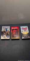 Front view of three VHS tapes: Best In Show, Apocalypse Now, Brazil