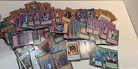 Wide shot of entire spread of Yu-Gi-Oh cards on table