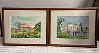 Both framed paintings side by side