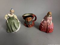 Group shot of both figurines and Toby creamer