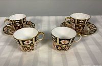 Front view showing 4 teacups and 2 saucers