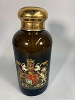 Full view of amber apothecary jar with gilt stopper