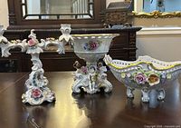 Three German porcelain pieces: candelabra, pedestal compote, fruit bowl