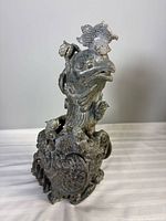 Full left profile of carved jade phoenix incense burner