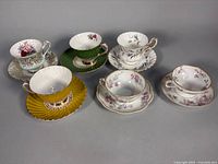Group of six teacup and saucer sets