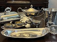 group shot of all silver plated items on table