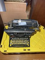 Front and top view of Underwood typewriter showing carriage and branding