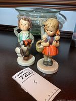 Front view of both Hummel figurines