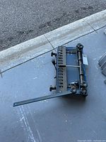 Top view of dovetail jig showing template bar, knobs and clamping rod