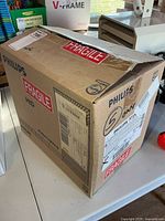 Closed Philips carton with fragile labels