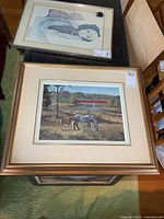 Framed print on table showing overall piece