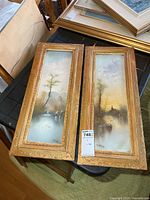 Both framed pastel artworks side by side