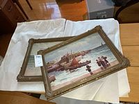 Both framed prints stacked, showing general condition and ornate frames