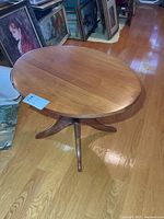 Full view of side table among framed art