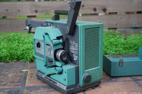 left-front view of Bell & Howell Filmosound 1580 projector showing control panel and film path