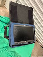 Monitor in open Porta Brace case showing screen and controls