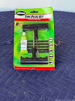 Front view of sealed Slime tire plug kit packaging