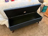 Bench with lid open showing interior storage