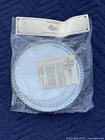 Sealed package showing two flan pans with papers