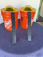 Front view of both bucket rat traps with ramps attached