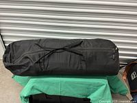 Tent packed in black zippered carry bag