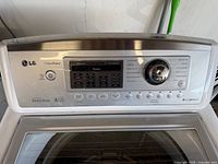 Control panel showing LG branding, WaveForce, Direct Drive, and cycle knob