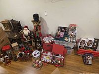 Overview of entire lot showing ornaments, nutcrackers, Santa figure, teddy bear, boxed items