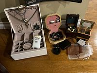 overall lot showing jewellery chest, two musical boxes, assorted jewellery items and accessories