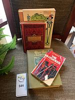Lot overview showing four books on chair