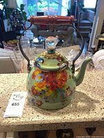 Front view of MacKenzie-Childs floral enamel teapot showing overall design and condition