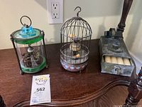 Group shot of fish automaton, bird automaton, candle box