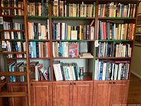 Full bookshelf showing majority of the 40 volumes