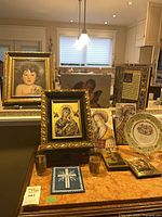 Group shot showing oil painting, icons, plate, plaques, box, votives