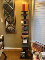 Full view of metal book tower with books