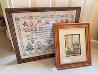 Both framed pieces leaning against wall for scale