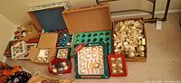 Overview of all boxes of ornaments and bows on floor