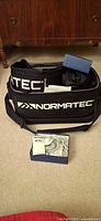 Normatec carry bag, sleeve, booklet and IQ Massager box