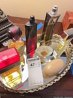 Group shot of all perfume bottles on mirror tray
