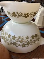 Two white Spring Blossom Cinderella Pyrex bowls stacked