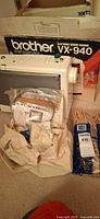 Overall lot showing sewing machine, box, clothespins, craft kits
