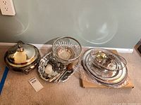 Casserole, crumb tray and brush, glass bowl, stack of trays and dishes
