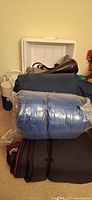 Overall view: cooler, sleeping bags, tote