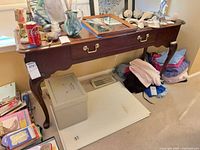 Full view of Thomasville cherry console table with drawer and cabriole legs