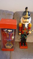 Both nutcrackers, boxed 17 in. and freestanding 24 in.