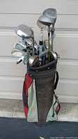 Full view of golf bag filled with clubs