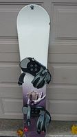 Full view of Hurley snowboard with bindings attached