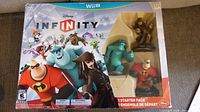 Front view of boxed Disney Infinity Starter Pack with figures visible