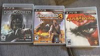 Front covers of the three PS3 game cases