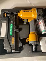 Nailer, case interior, nail pack visible