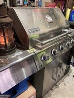 Front three-quarter view showing brand badge, control panel and lantern not included